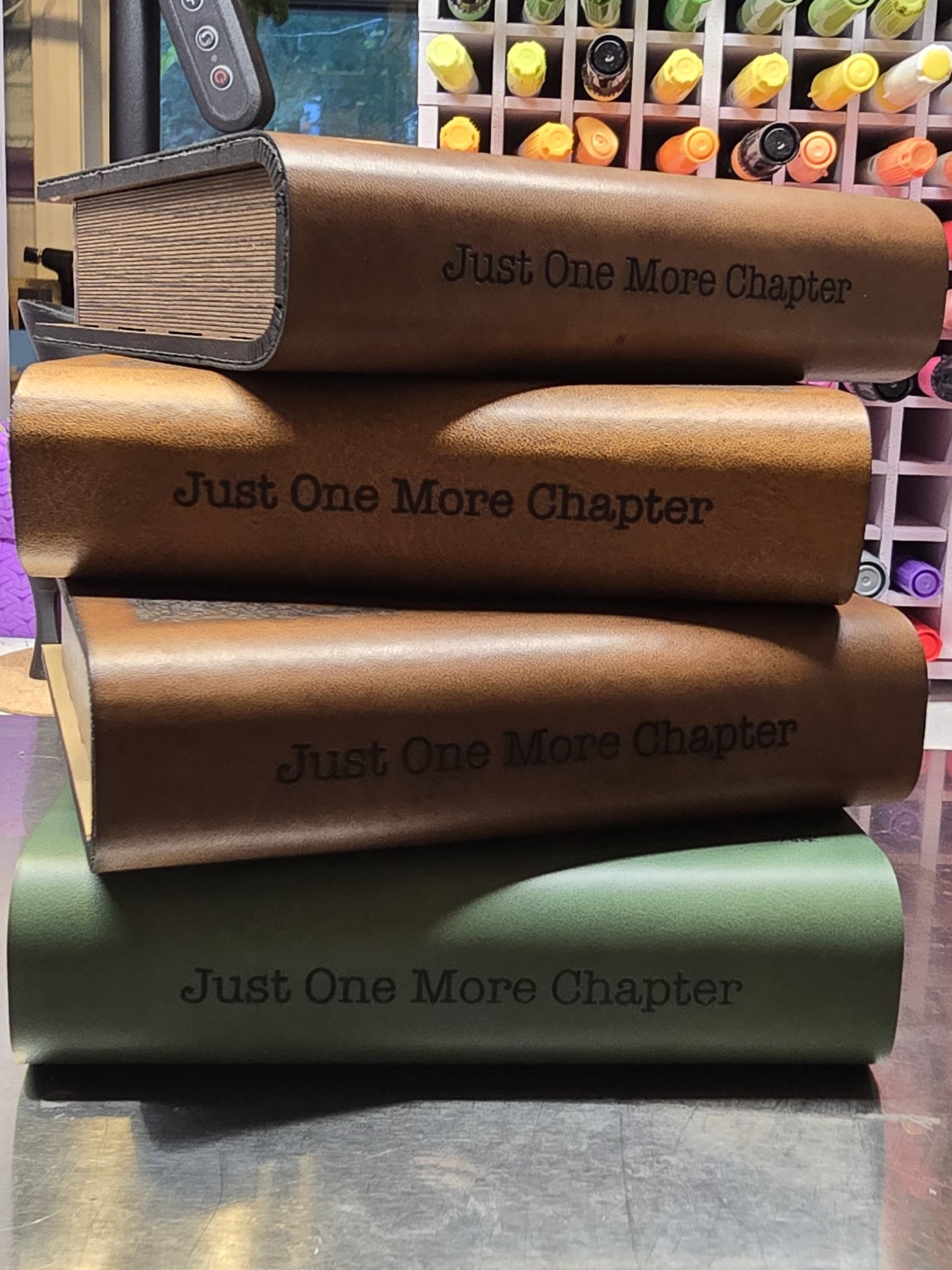 Stack of book-shaped coaster sets with storage