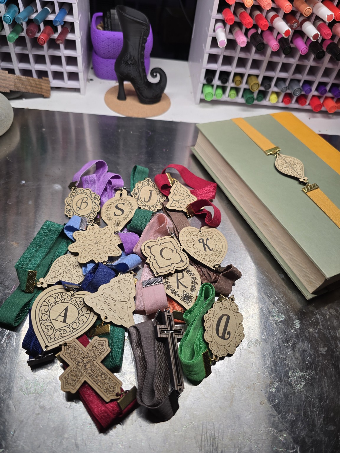 A collection of engraved wooden ribbon bookmarks