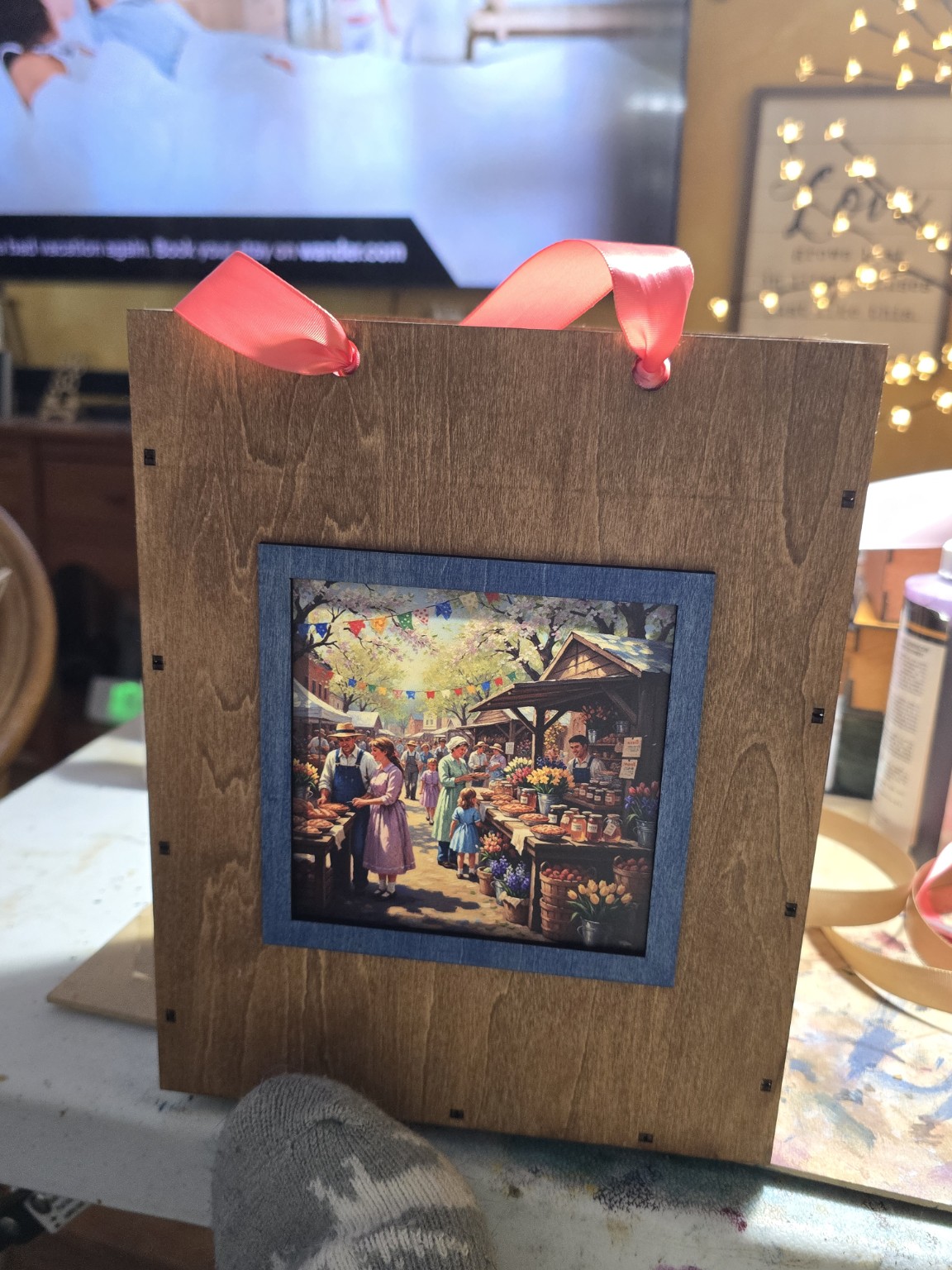 Handmade wooden gift bag with a colorful market scene