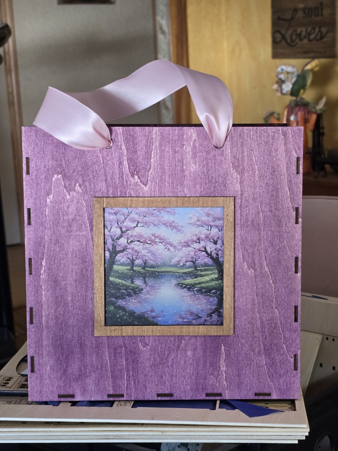 Handmade purple wooden gift bag with a colorful market scene