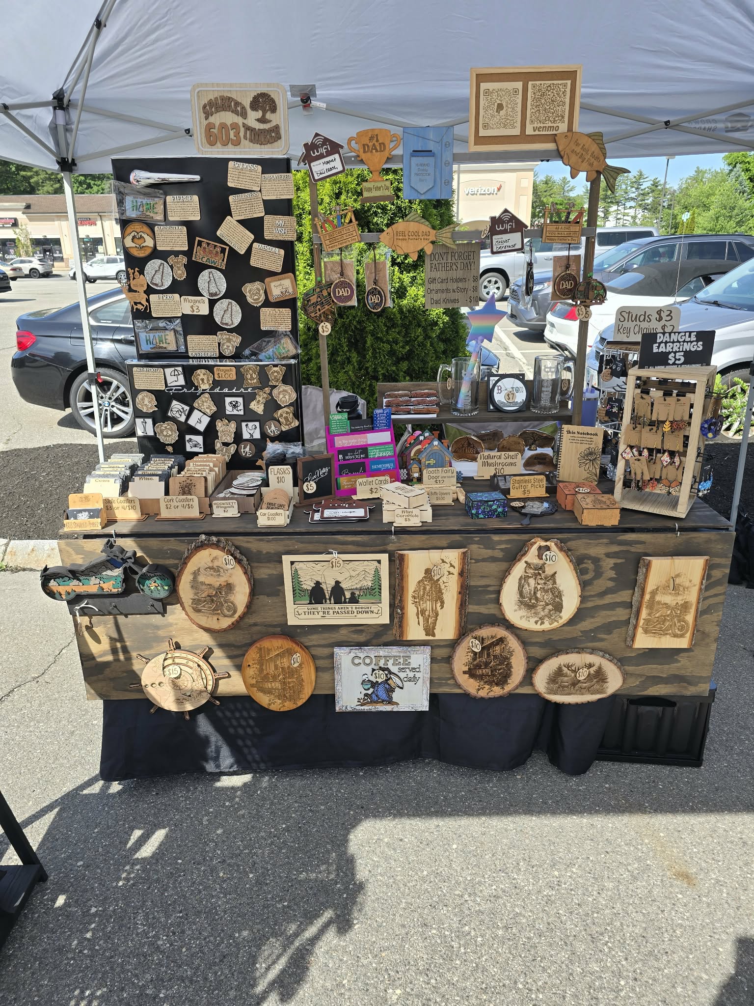 Front view of the 603SparkedTimber market booth filled with handmade creations