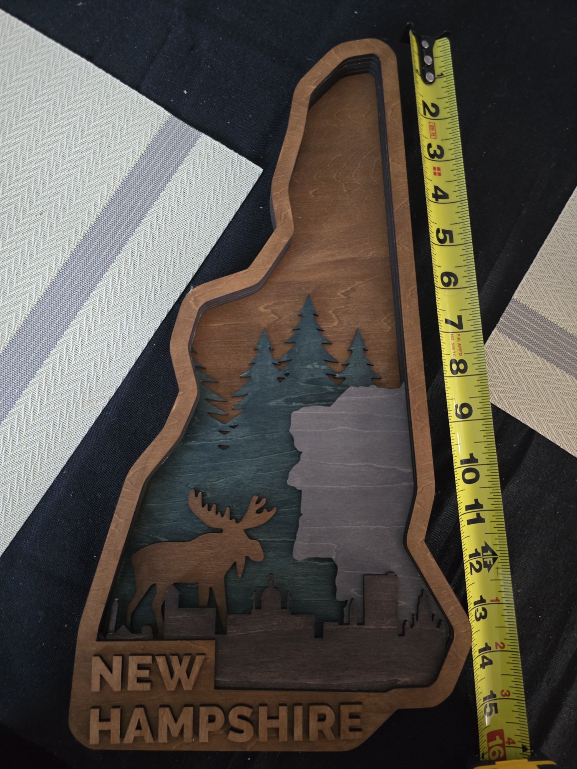 Layered New Hampshire themed wall art with mountains, trees and moose