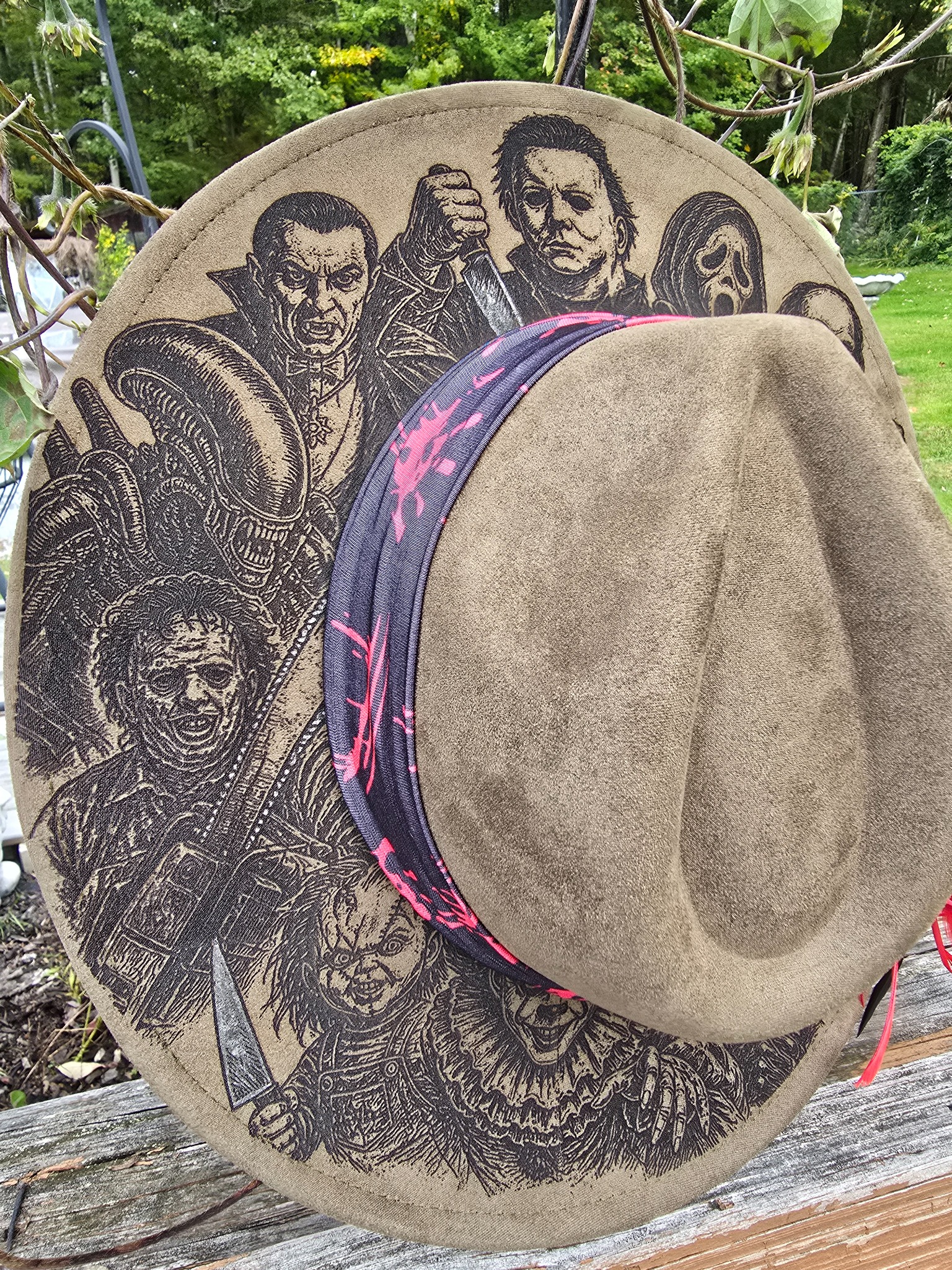 Close view of the engraved horror artwork around the hat brim
