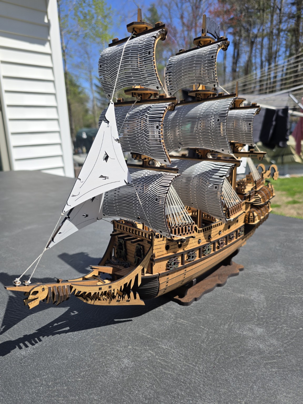 Engraved sailing ship artwork on wood