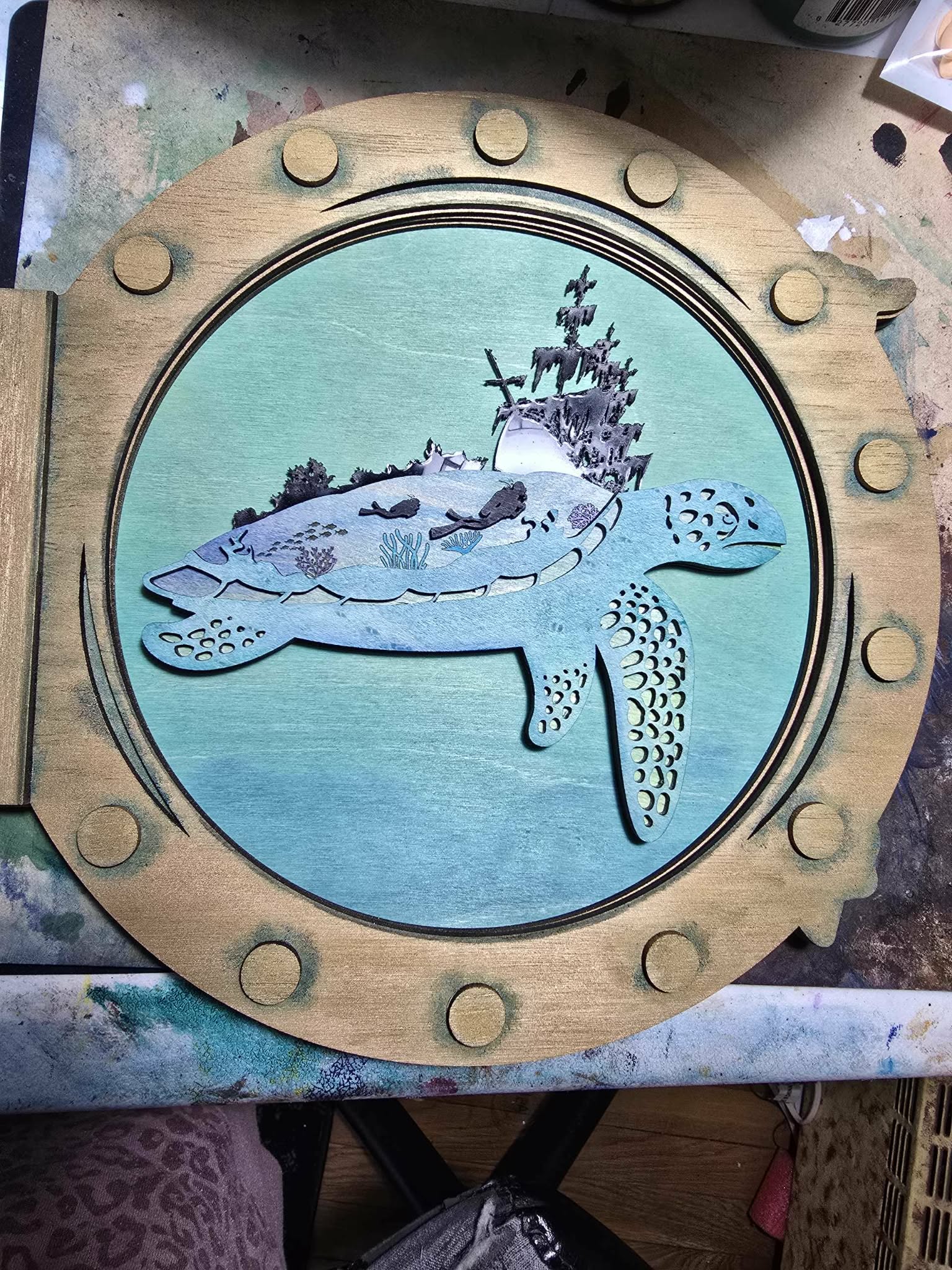 Layered sea turtle artwork in blue and purple tones