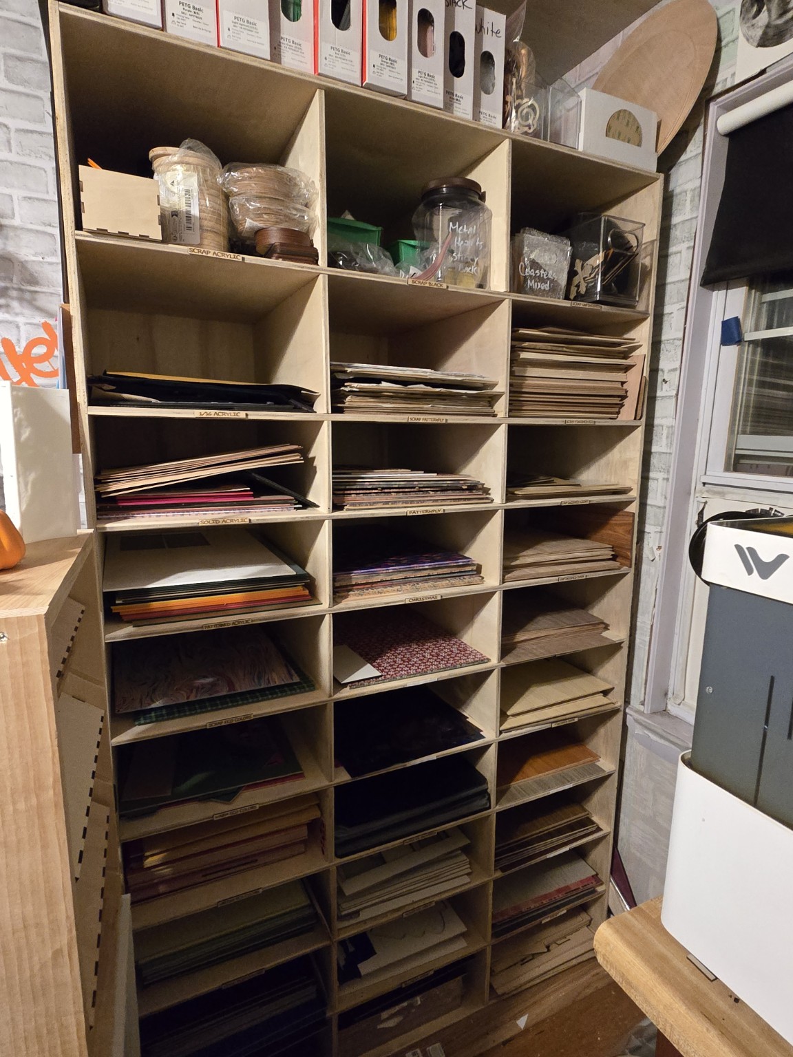 Wood and acrylic materials organized in the 603SparkedTimber workshop